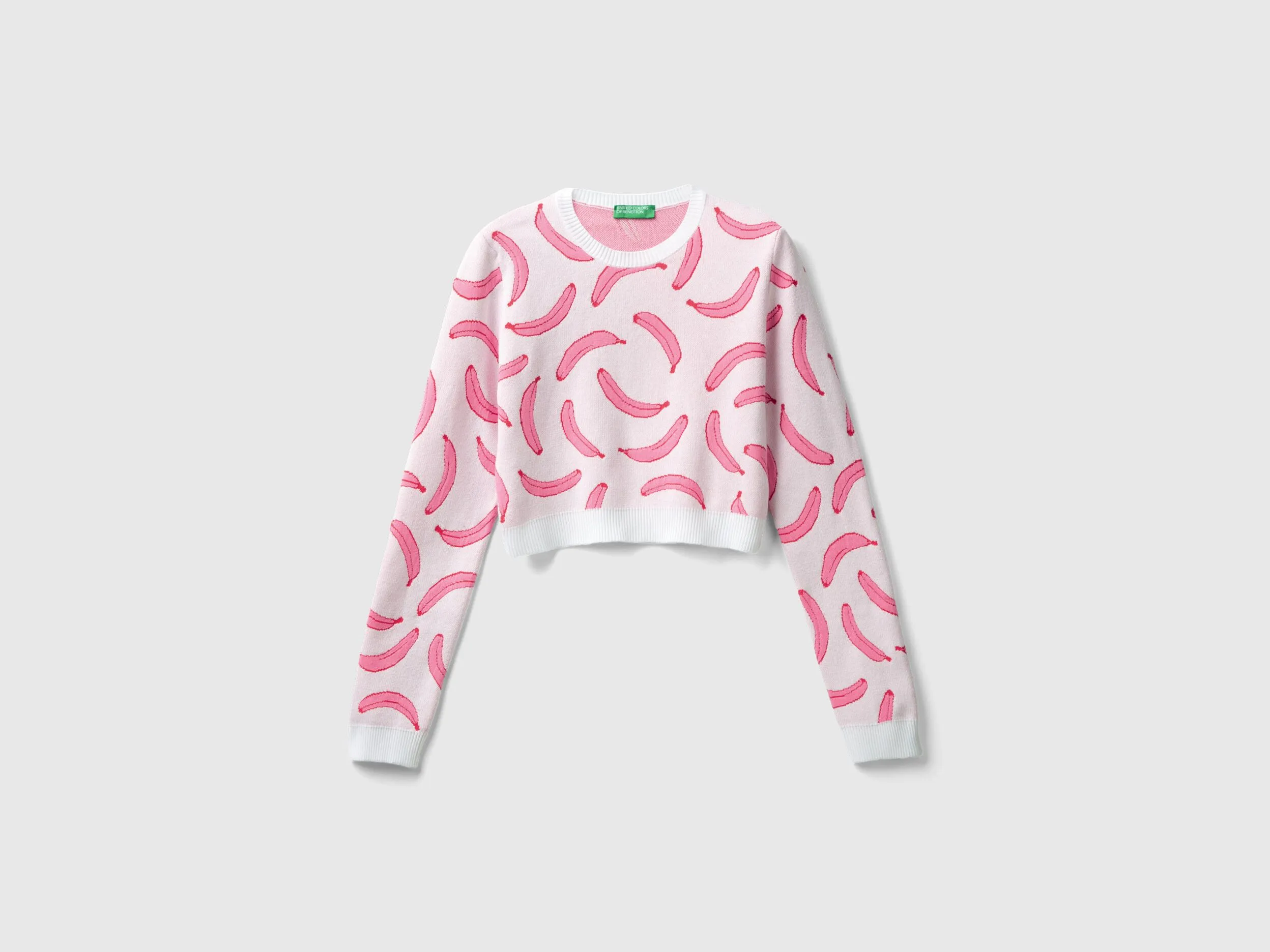 Jersey cropped rosa claro con estampado de plátanos